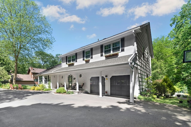 136 Knorr Rd, Monroe, CT 06468 - view of front of property featuring a garage, driveway, a shingled roof, and brick siding
