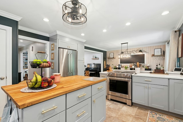 136 Knorr Rd, Monroe, CT 06468 - kitchen featuring high quality appliances, butcher block counters, gray cabinetry, crown molding, and decorative light fixtures