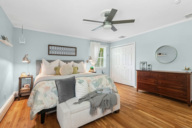 136 Knorr Rd, Monroe, CT 06468 - bedroom with baseboard heating, ornamental molding, wood finished floors, a closet, and a ceiling fan