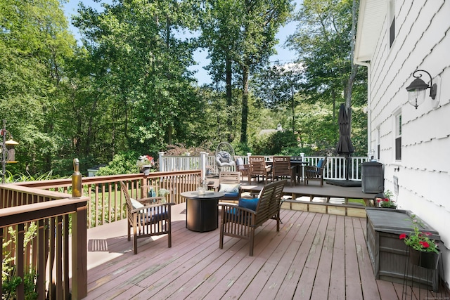 136 Knorr Rd, Monroe, CT 06468 - wooden terrace featuring outdoor dining area and view of wooded area