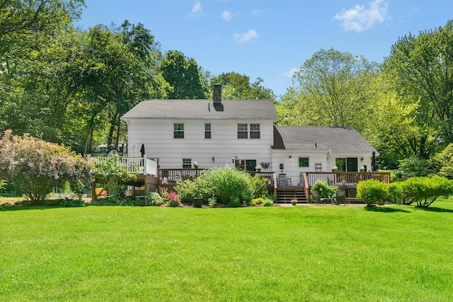 136 Knorr Rd, Monroe, CT 06468 - rear view of house with a deck, a yard, a chimney, and view of wooded area
