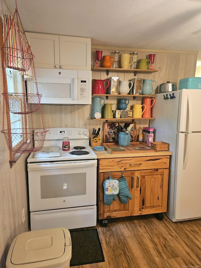 15 Ledge Rd, Lebanon, CT 06249 - kitchen with white appliances, wood finished floors, light countertops, a textured ceiling, and white cabinets