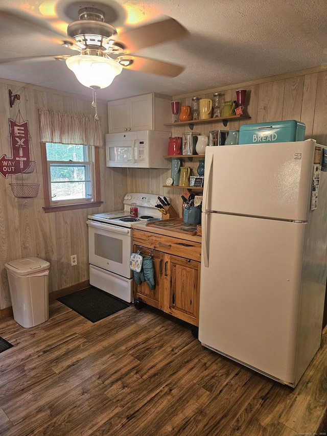 15 Ledge Rd, Lebanon, CT 06249 - kitchen featuring white appliances, dark wood finished floors, a ceiling fan, wooden walls, and a textured ceiling