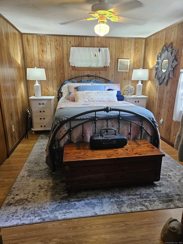 15 Ledge Rd, Lebanon, CT 06249 - bedroom with wood walls, a ceiling fan, and wood finished floors