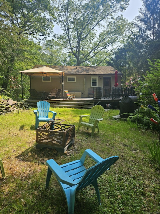 15 Ledge Rd, Lebanon, CT 06249 - view of grassy yard featuring a fire pit and a wooden deck