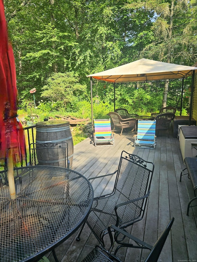 15 Ledge Rd, Lebanon, CT 06249 - wooden deck featuring outdoor dining space and a forest view
