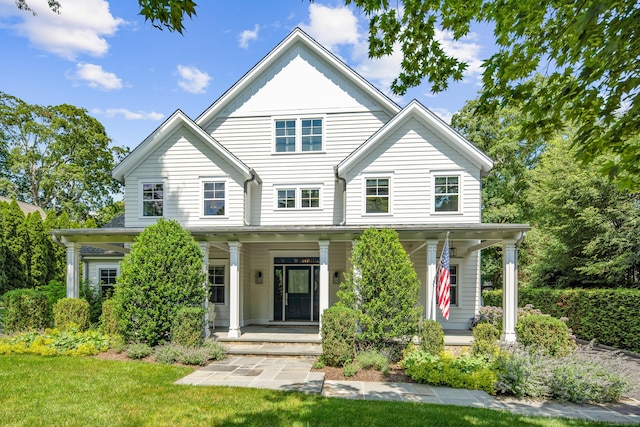 74 Brookside Rd, Darien, CT 06820 - view of front of property with covered porch and a front lawn