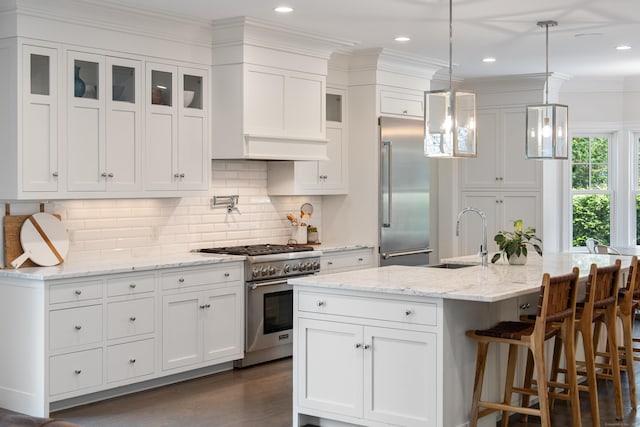 74 Brookside Rd, Darien, CT 06820 - kitchen with high end appliances, white cabinetry, glass insert cabinets, ornamental molding, and recessed lighting