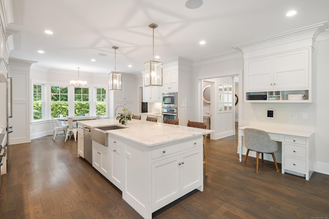 74 Brookside Rd, Darien, CT 06820 - kitchen with white cabinetry, recessed lighting, ornamental molding, dark wood finished floors, and a kitchen island with sink