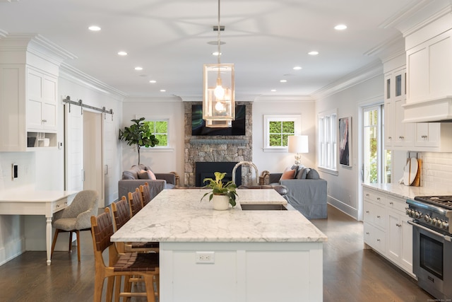 74 Brookside Rd, Darien, CT 06820 - kitchen featuring high end stainless steel range oven, open floor plan, a barn door, white cabinets, and recessed lighting
