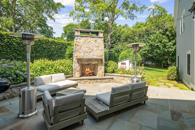 74 Brookside Rd, Darien, CT 06820 - view of patio / terrace with an outdoor living space with a fireplace