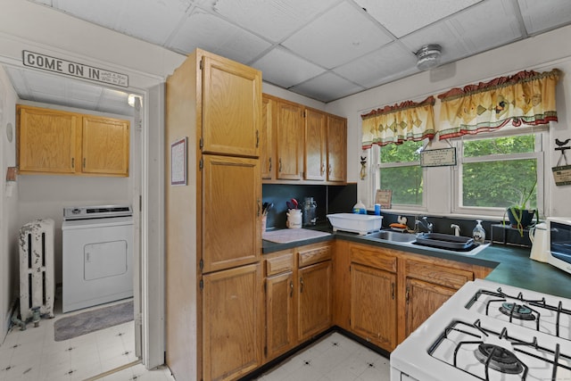 96 Melbourne Ter, Waterbury, CT 06704 - kitchen with washer / clothes dryer, light floors, radiator, range, and a paneled ceiling