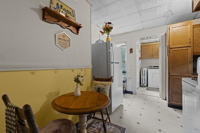96 Melbourne Ter, Waterbury, CT 06704 - dining room with independent washer and dryer and radiator