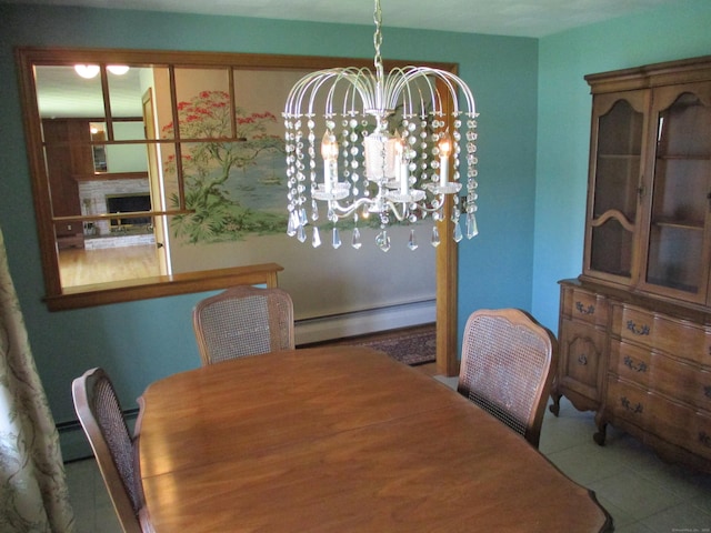 8 Susan Ln, Meriden, CT 06450 - dining area with baseboard heating, a chandelier, and tile patterned floors