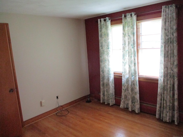 8 Susan Ln, Meriden, CT 06450 - empty room featuring healthy amount of natural light and light wood finished floors
