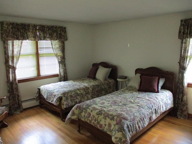 8 Susan Ln, Meriden, CT 06450 - bedroom featuring light wood-type flooring and a baseboard radiator
