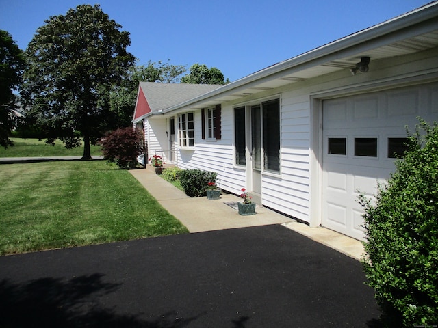 8 Susan Ln, Meriden, CT 06450 - view of property exterior featuring a lawn and a garage