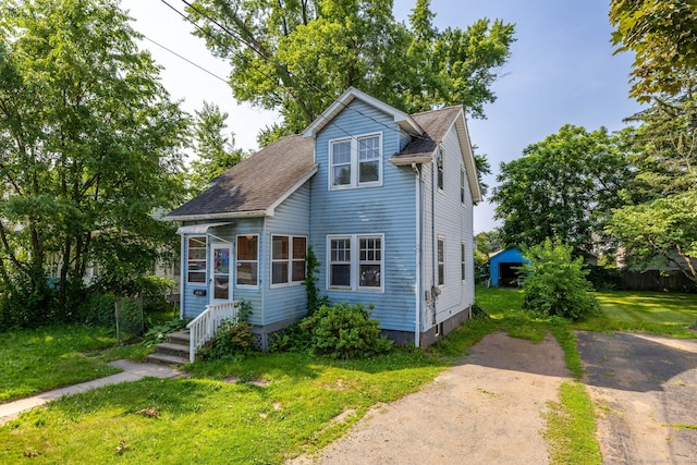 49 Richard Rd, East Hartford, CT 06119 - view of front of house featuring a front lawn and a shingled roof