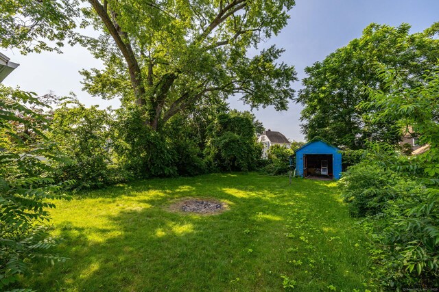 49 Richard Rd, East Hartford, CT 06119 - view of grassy yard with a storage unit