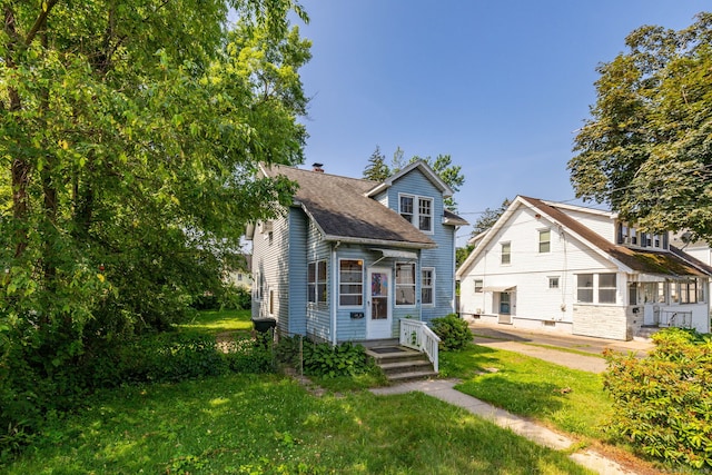 49 Richard Rd, East Hartford, CT 06119 - view of front facade featuring a front yard, a chimney, and a shingled roof