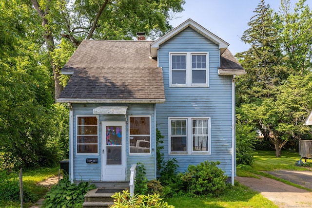 49 Richard Rd, East Hartford, CT 06119 - view of front of house featuring roof with shingles and a chimney
