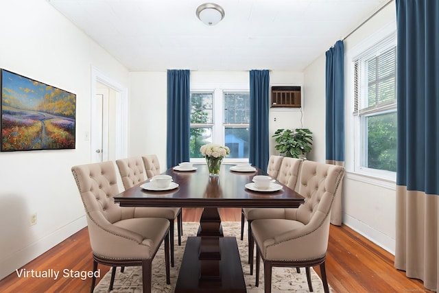 49 Richard Rd, East Hartford, CT 06119 - dining space with wood finished floors, plenty of natural light, and a wall mounted air conditioner