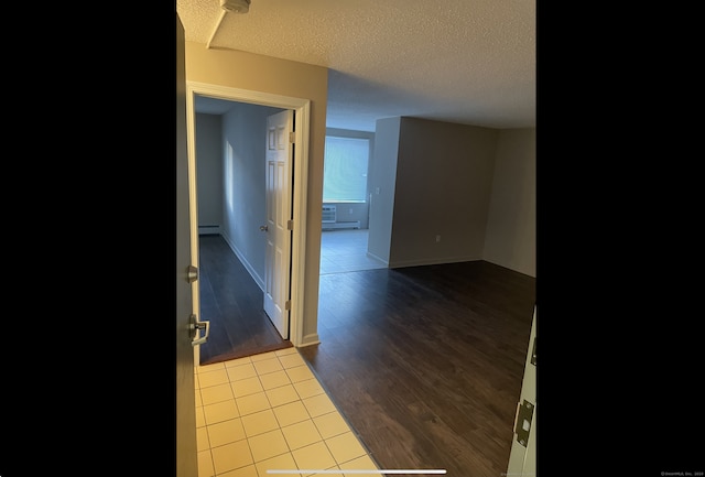 755 Wethersfield Ave Apt A5, Hartford, CT 06114 - hall featuring a textured ceiling, dark wood-style flooring, and baseboard heating