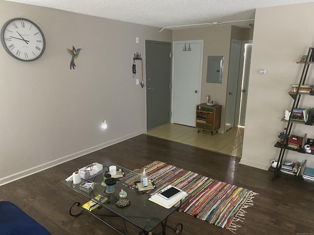 755 Wethersfield Ave Apt A5, Hartford, CT 06114 - living area featuring wood finished floors, electric panel, and a textured ceiling