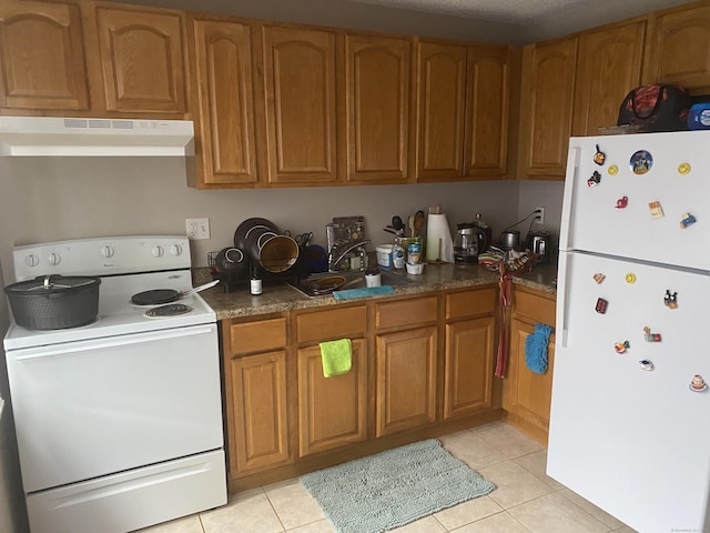 755 Wethersfield Ave Apt A5, Hartford, CT 06114 - kitchen with white appliances, under cabinet range hood, brown cabinetry, and light tile patterned floors