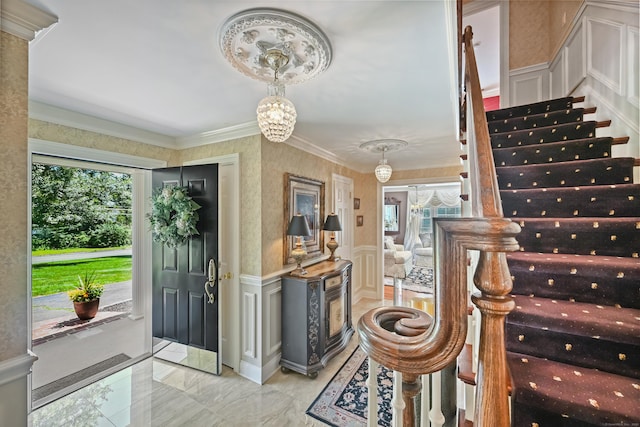 40 Hawley Rd, Danbury, CT 06811 - foyer entrance featuring a decorative wall, healthy amount of natural light, stairway, a wainscoted wall, and crown molding