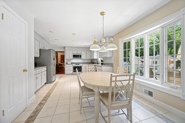 40 Hawley Rd, Danbury, CT 06811 - dining room with light tile patterned floors, a chandelier, recessed lighting, and inlaid floor details