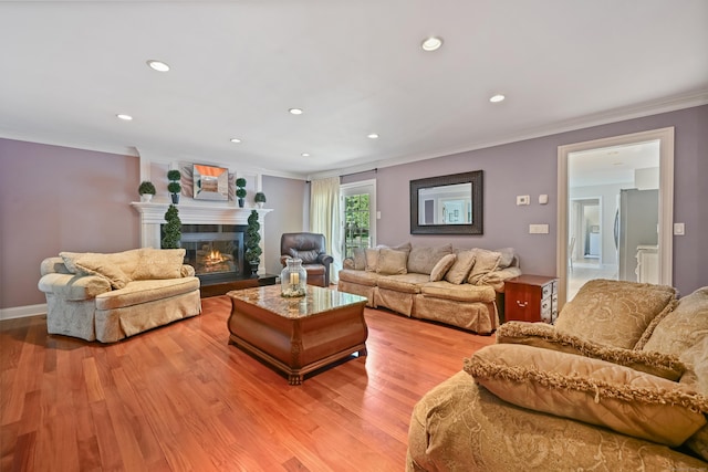 40 Hawley Rd, Danbury, CT 06811 - living room with crown molding, light wood-style floors, a glass covered fireplace, and recessed lighting
