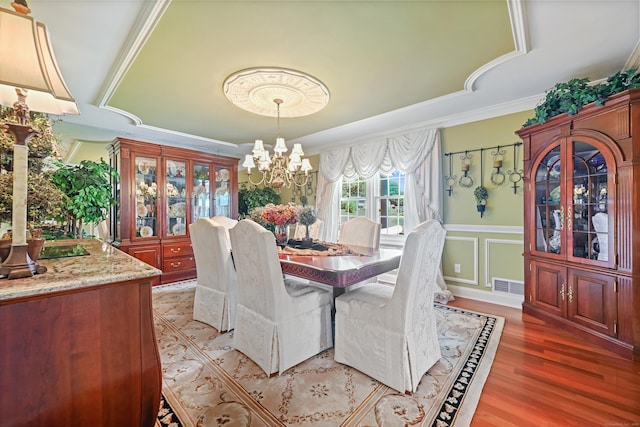 40 Hawley Rd, Danbury, CT 06811 - dining room featuring a chandelier, light wood finished floors, crown molding, a wainscoted wall, and a decorative wall