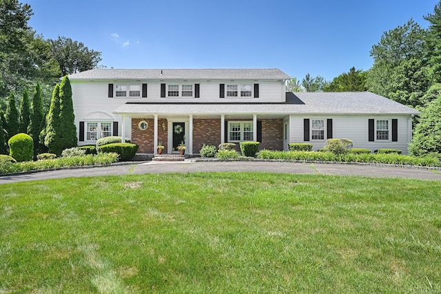 40 Hawley Rd, Danbury, CT 06811 - view of front of property with a front lawn, a porch, and driveway