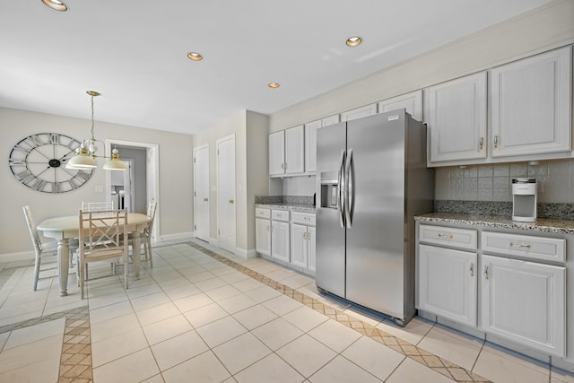 40 Hawley Rd, Danbury, CT 06811 - kitchen featuring stainless steel refrigerator with ice dispenser, light tile patterned flooring, tasteful backsplash, recessed lighting, and hanging light fixtures