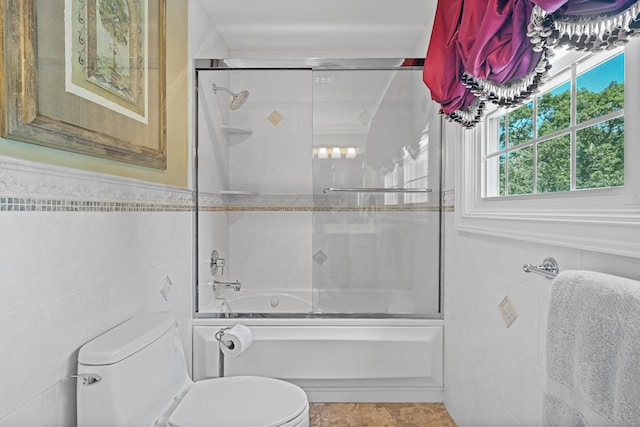 40 Hawley Rd, Danbury, CT 06811 - bathroom featuring tile walls, bath / shower combo with glass door, and tile patterned floors