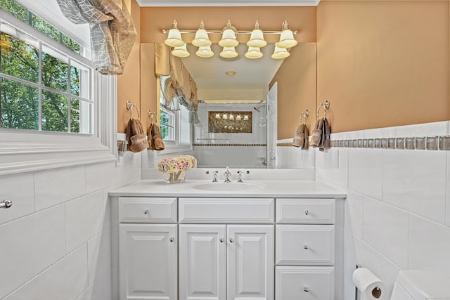 40 Hawley Rd, Danbury, CT 06811 - bathroom with tile walls, tiled shower, plenty of natural light, and vanity