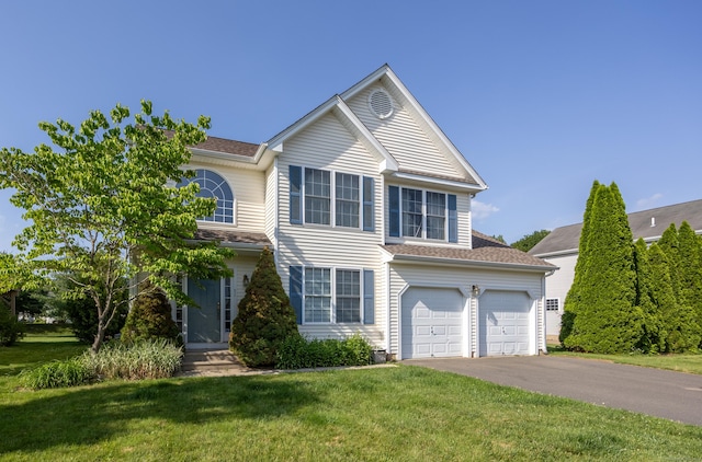 51 Schoolhouse Lndg Unit 51, East Granby, CT 06026 - traditional-style home with driveway, a front yard, and an attached garage