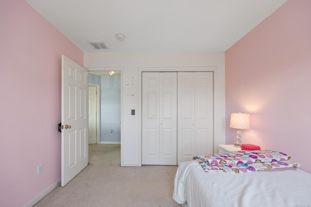 51 Schoolhouse Lndg Unit 51, East Granby, CT 06026 - bedroom featuring light carpet and a closet