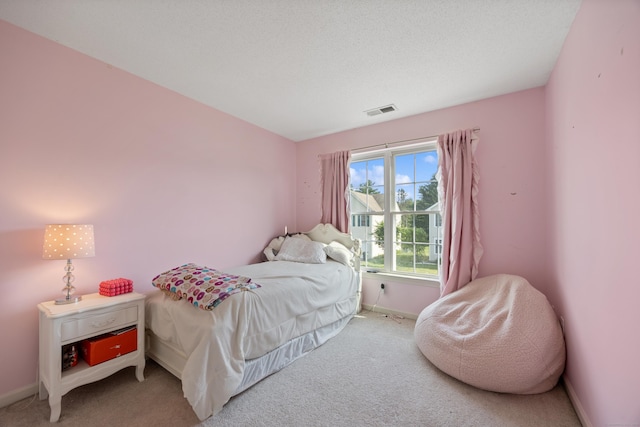 51 Schoolhouse Lndg Unit 51, East Granby, CT 06026 - bedroom with light colored carpet and baseboards