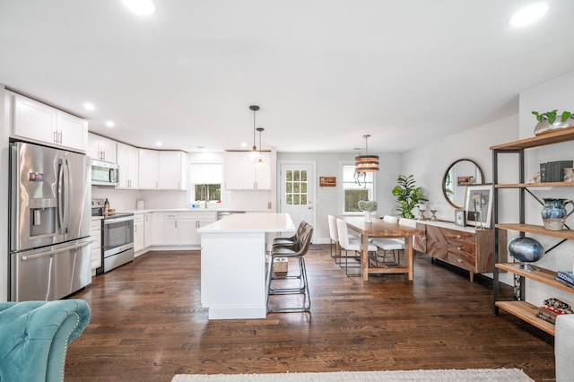51 Mountain View Dr, Brookfield, CT 06804 - kitchen with appliances with stainless steel finishes, recessed lighting, light countertops, white cabinets, and dark wood finished floors