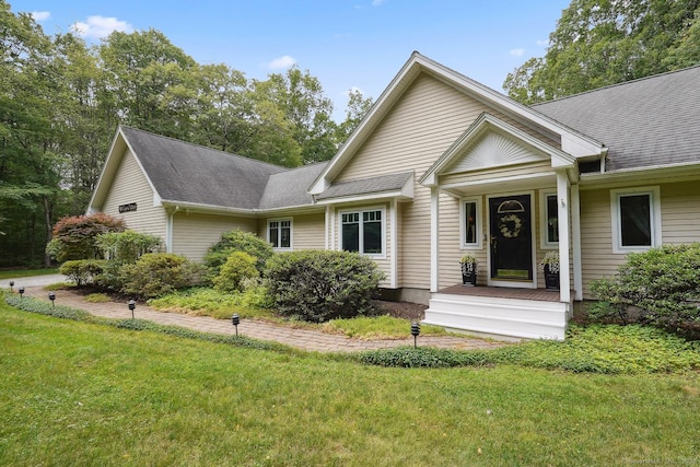115 Center Rd, Woodstock, CT 06281 - view of front of house featuring a front yard and a shingled roof