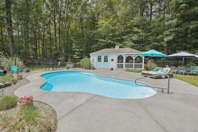 115 Center Rd, Woodstock, CT 06281 - view of swimming pool featuring a patio area, an outdoor structure, and a storage structure