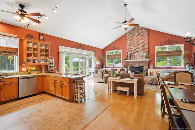 115 Center Rd, Woodstock, CT 06281 - kitchen with dishwasher, ceiling fan, open floor plan, a peninsula, and high vaulted ceiling