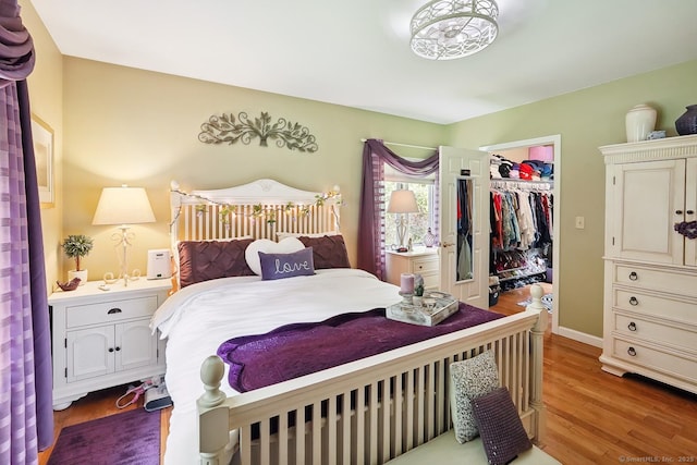115 Center Rd, Woodstock, CT 06281 - bedroom with wood finished floors, a walk in closet, and a closet