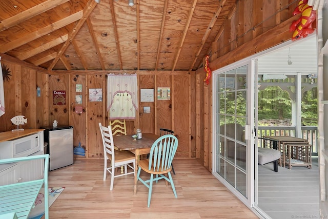 115 Center Rd, Woodstock, CT 06281 - dining area with lofted ceiling, light wood-style flooring, and wood walls