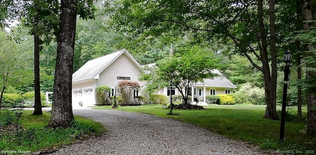 115 Center Rd, Woodstock, CT 06281 - view of front facade featuring a garage, a front lawn, and driveway