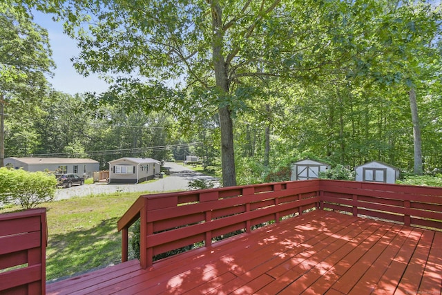 28 Nashua St, Norwich, CT 06360 - wooden terrace featuring a storage unit and a lawn