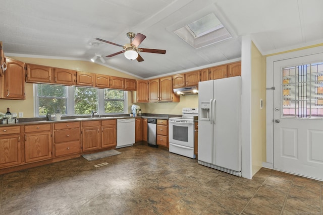 28 Nashua St, Norwich, CT 06360 - kitchen with white appliances, under cabinet range hood, a skylight, ceiling fan, and vaulted ceiling