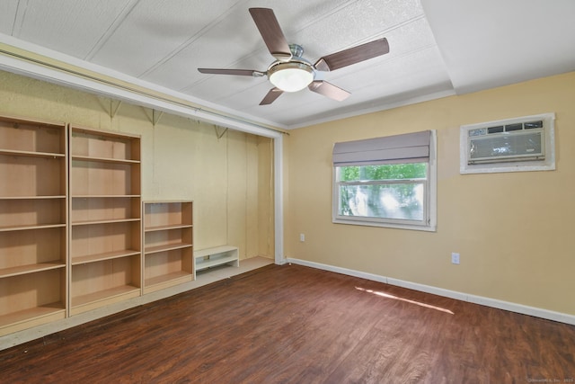 28 Nashua St, Norwich, CT 06360 - unfurnished bedroom with dark wood finished floors, a wall unit AC, a ceiling fan, and a closet